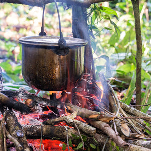 QuickSurvive The Best Fire Starters For Camping and Outdoors - Waterproof fire starters - formerly quick fire starters. Campfire ring with QuickSurvive Fire Starter Boiling pot of water